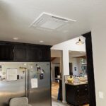 Mitsubishi 4-way cassette indoor unit installed in a residential home as part of a multi-zone ductless system by Americool Comfort