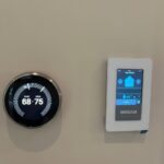 Nest smart thermostat and Broan ventilation controller installed by Americool Comfort for Title 24 residential HVAC compliance